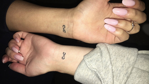 Syracuse University students Jane Kim and Katie Morris have a carbon bond. To mark their friendship, the two best friends got tattoos of a double carbon bond. 